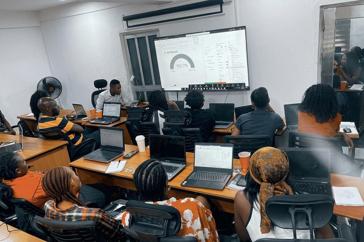 Learners at laptops following a live Power BI session at 3DP Academy